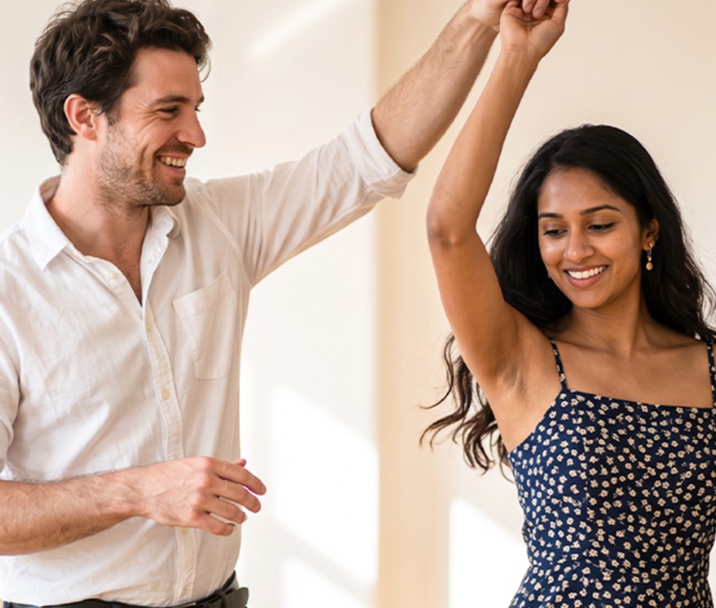Couple enjoying a ballroom-style dance dip during a lesson