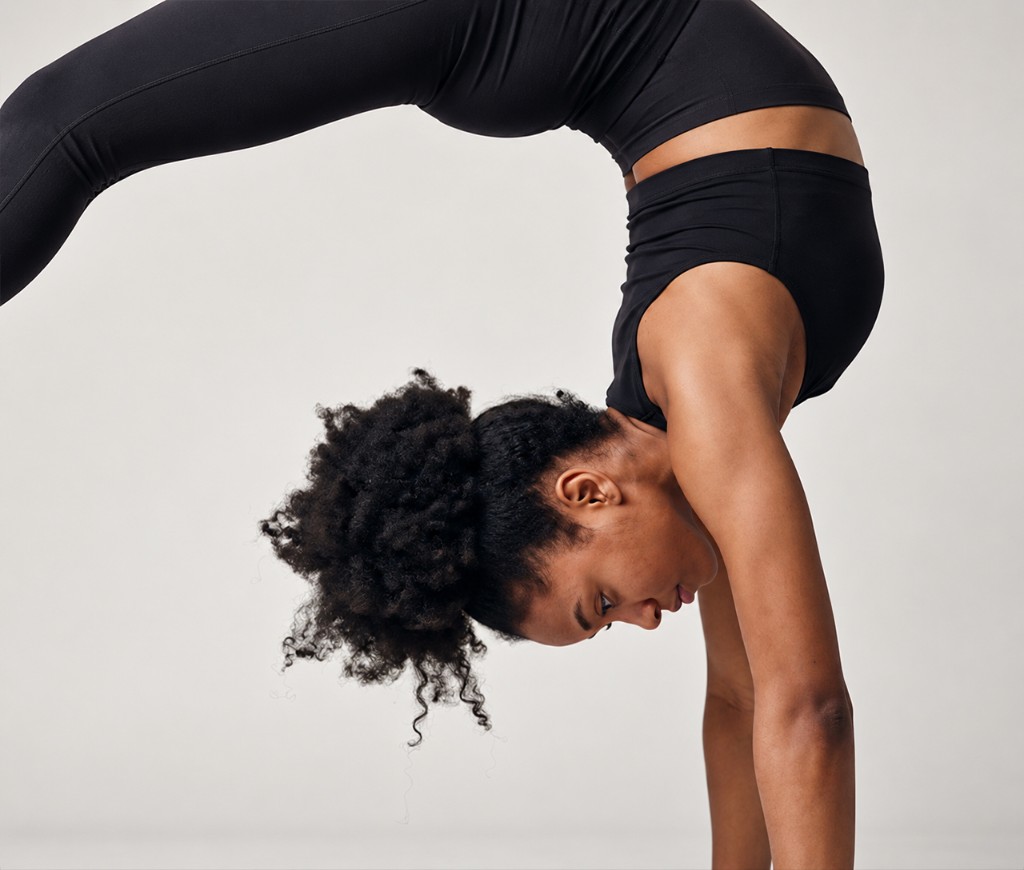 Dancer training acrobatics in class